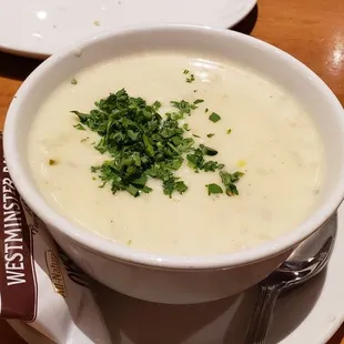 Cup of clam chowder. Love it! Just right texture and flavor.