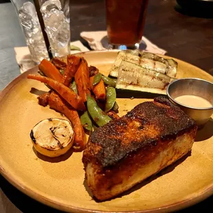 Blackened Swordfish, vegetables and grilled zucchini