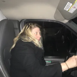 a woman driving a car