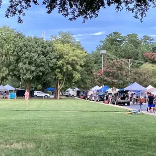 A view from the back of the market looking back; it extends from the front of the church to around one side of the church/fellowship hall