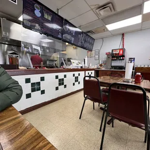 a man sitting at a table in a restaurant