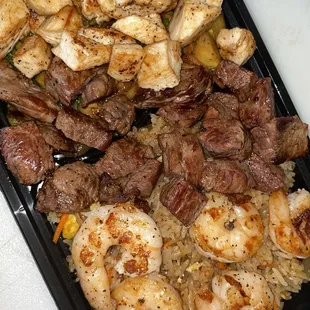 a tray of meat and vegetables