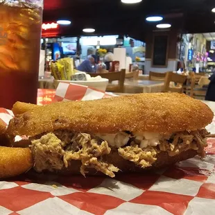 Pig-In-A-Puppy pork and slaw in a hushpuppy boat.