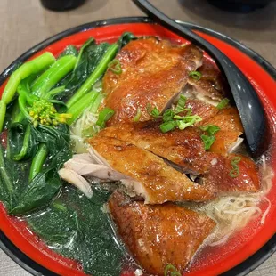 a bowl of soup with meat and vegetables