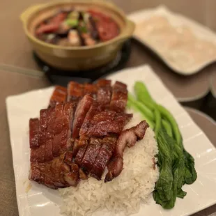 a plate of meat and rice