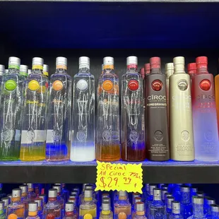 a shelf of liquor bottles