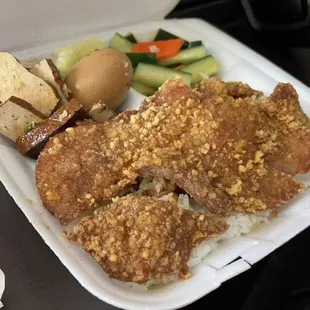 Fried pork chop over rice