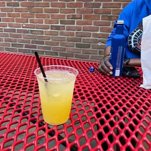 a glass of orange juice on a table