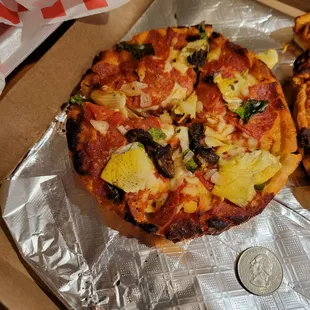 Quarter for size reference this is a large Queens pizza??!!!