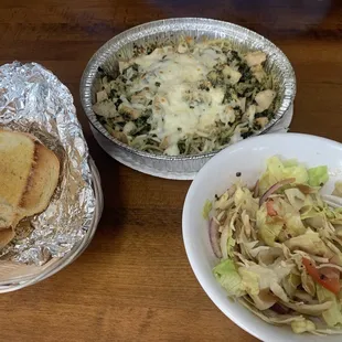 Off menu request of spaghetti with pesto, cheese &amp; chicken, salad &amp; garlic bread. Delicious!