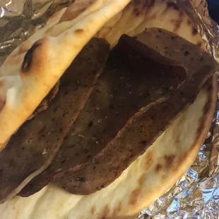 Delivery Gyros w/ 3 pieces of microwaved gyros meat. I ordered plain, but thought meat would be included.