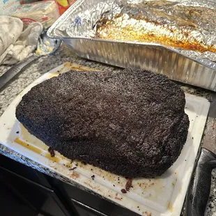 a large piece of cake sitting on a cutting board