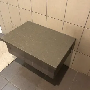 A place to sit if needed in the bathroom.