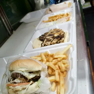 a row of trays of food