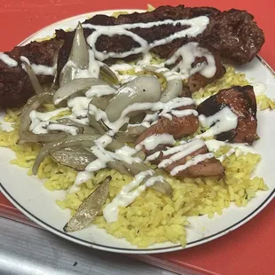 a plate of food with rice and meat
