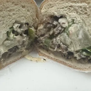 Philly cheesesteak, onions, peppers, and cheese