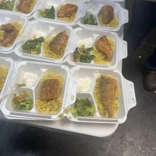 125 plates, fried fish, rice, salad, and sauce