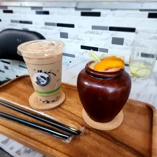 a cup of iced coffee and chopsticks