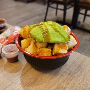 a bowl of fries and avocado