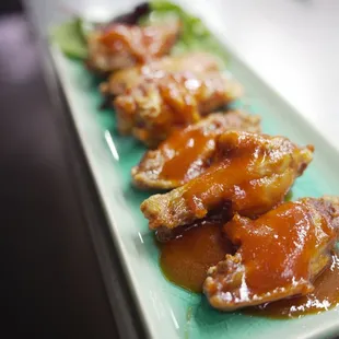 a plate of chicken wings
