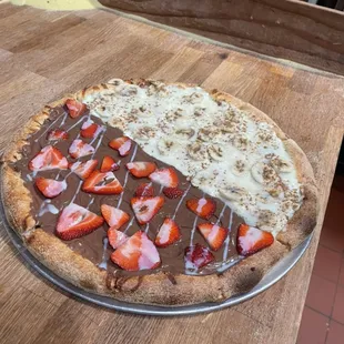 Dessert pizza Nutella with strawberries and banana cinnamon.