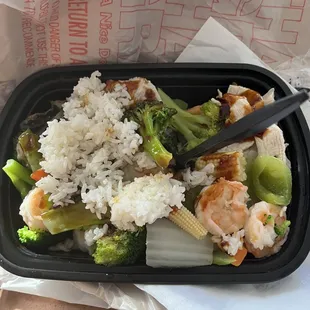 Sautéed chicken/shrimp/veggie and added steamed rice/sauce as desired.