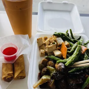 Flash fried green beans, spicy tofu and savory mushrooms, with peppers and carrots, to veggie spring rolls, and a Thai iced tea: $14.50.
