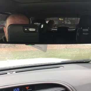 a man in the back seat of a car