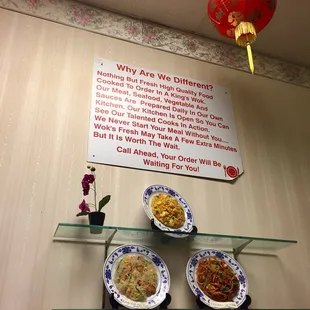 three plates of food on a glass shelf