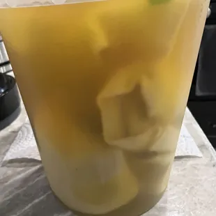 Yellow broth wonton soup with not much else in it
