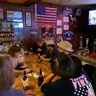 a group of people sitting at a bar