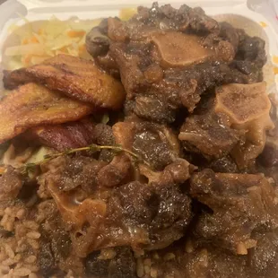 Oxtail, plantain, cabbage , rice & peas