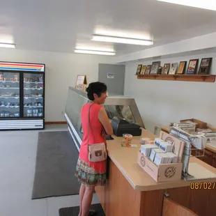 a woman standing at the counter