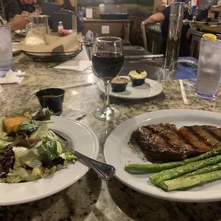 Rib steak with salad and asparagus