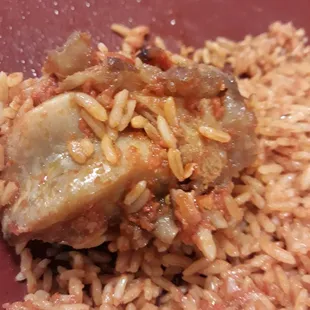 a plate of rice and meat