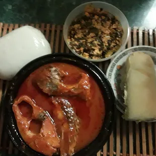 Red stew with Fish ( it looks like Tilapia) And egusi.