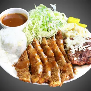 a plate of food with meat, rice, and coleslaw