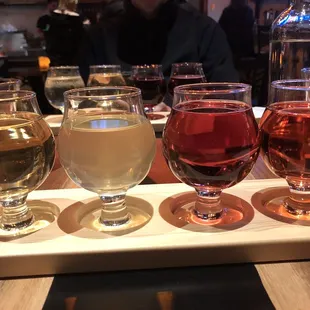 four glasses of wine on a tray
