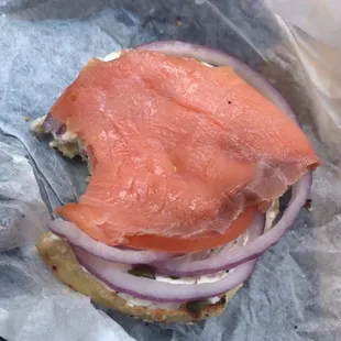Lox sandwich on everything bagel. I like that they split the sandwich in two. It also comes with a pickle on the side.