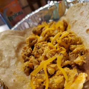 Chorizo and egg taco with shredded cheese