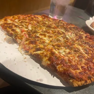 Pepperoni underneath the cheese with a heavy dose of oregano to make it authentic!