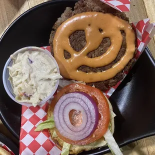 a hamburger and coleslaw