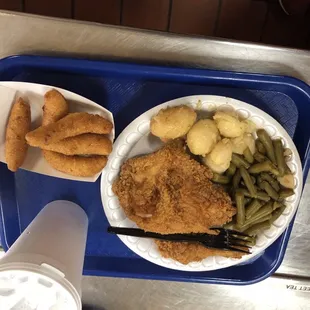 Fried chicken, green beans, potatoes, hush puppies and sweet tea