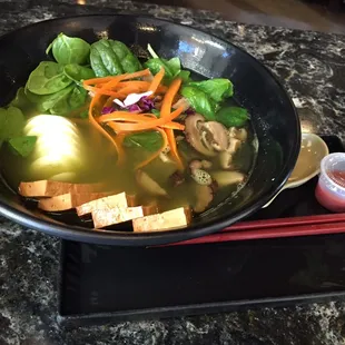 Green noodle bowl with tofu and boiled egg