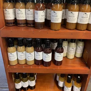 a shelf full of sauces and condiments