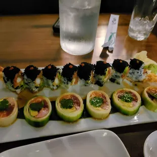 a plate of sushi rolls on a table