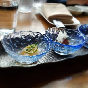 three bowls of food on a tray