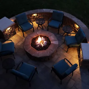 Paver patio with seat wall, lighting, &amp; firepit.