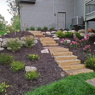 Flowerbed with flagstone steps.