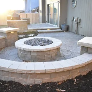 Firepit with seat wall.